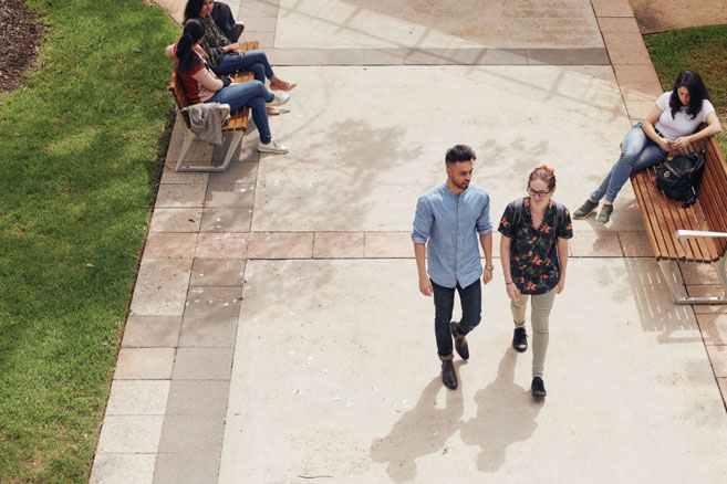 Two students walking to class